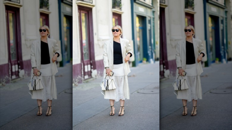 woman with black t-shirt and midi skirt