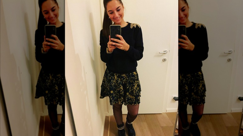 Black sweater black and gold skirt