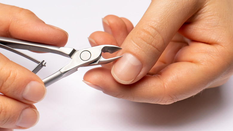 close up of cutting cuticles 