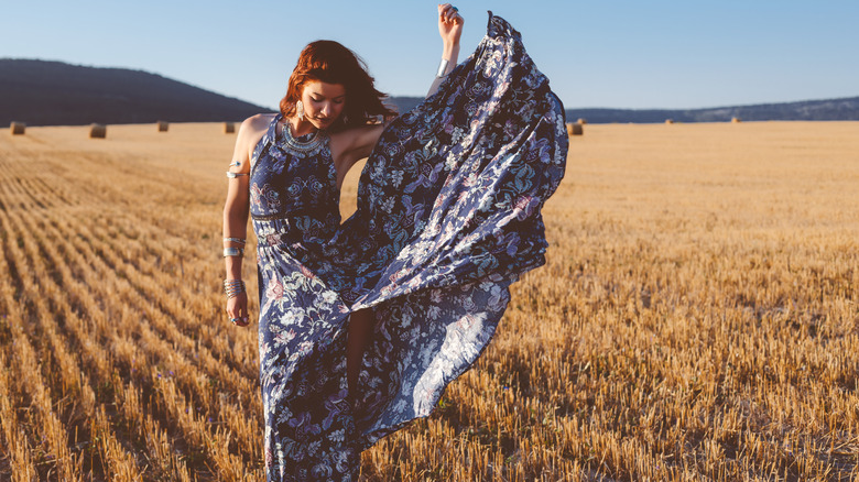 Woman with maxi dress in a field