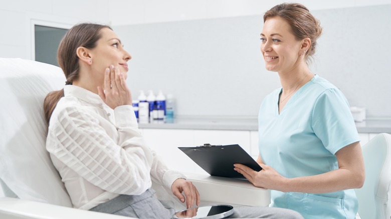 Woman talking to her facialist