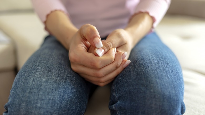 Woman's hands in her lap