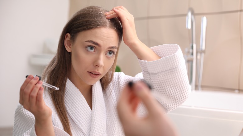 woman oiling scalp