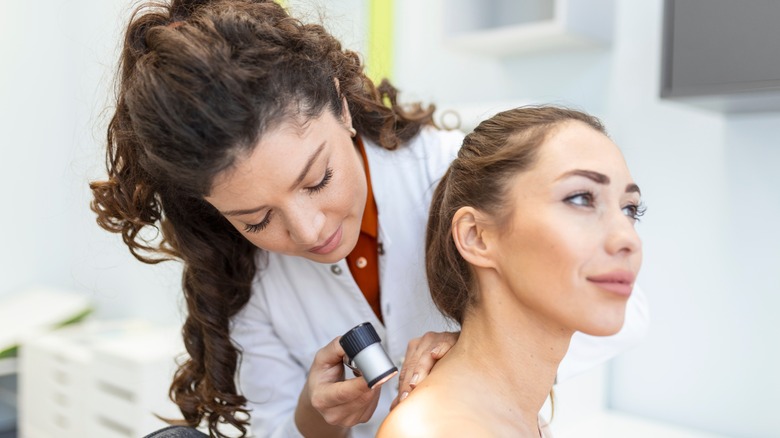 Female patient visiting with dermatologist