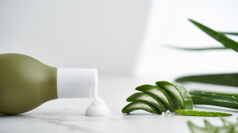 Aloe vera plant cream, marble surface