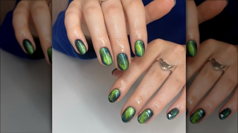 close up on green shimmer nails