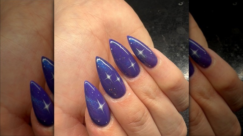 close up on purple nails with stars
