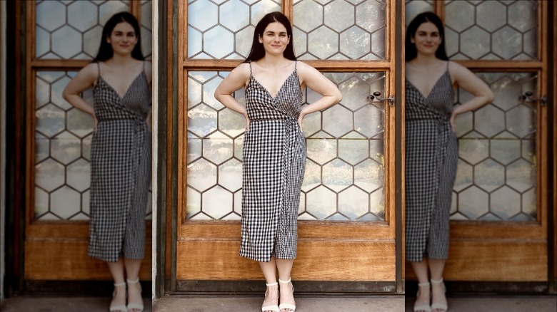 person in a gingham dress