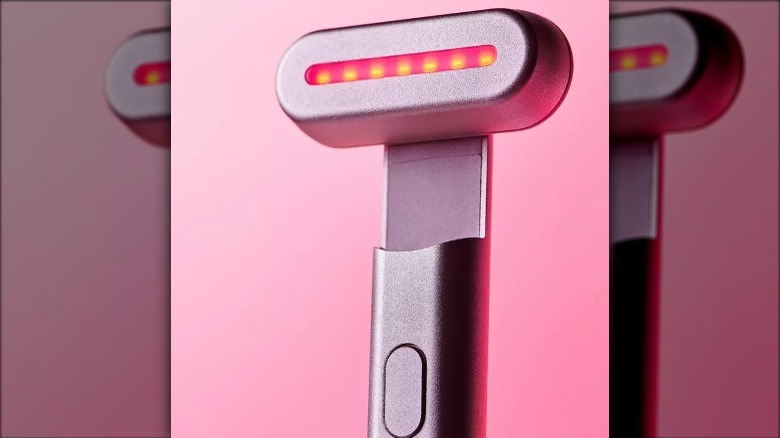 Solawave wand on pink background