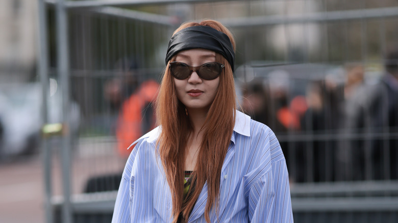 person wearing headband at fashion week