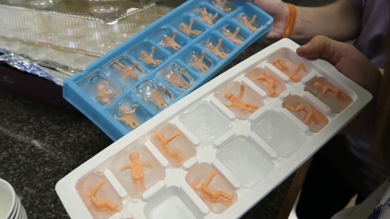 plastic babies in ice cubes