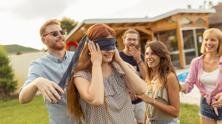 People playing game blindfolded 