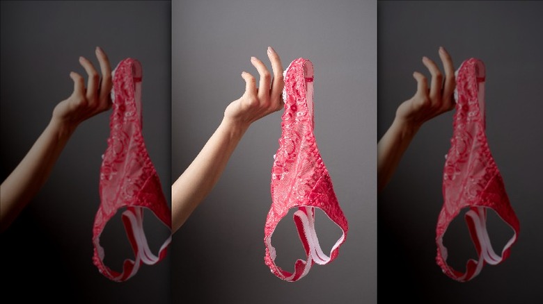woman holding underwear