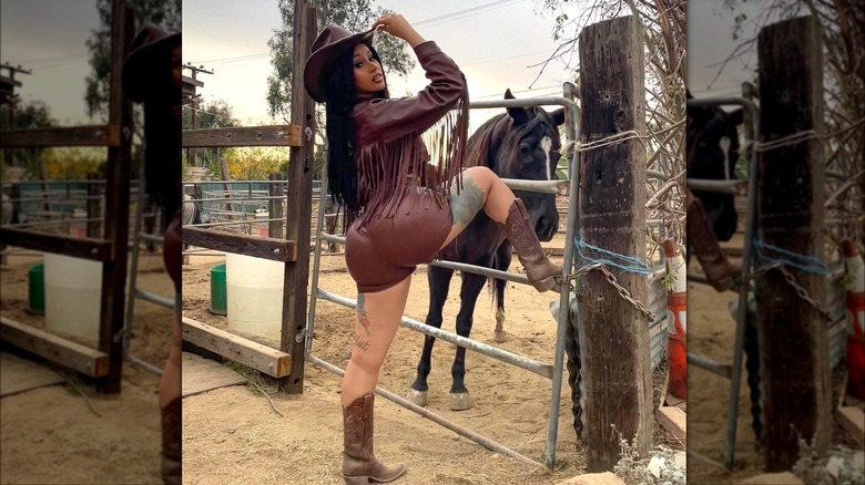 Cardi B dressed as a cowgirl