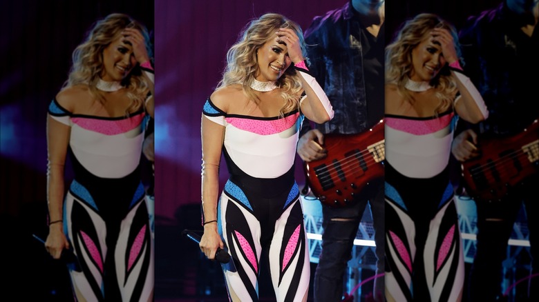 Carrie Underwood neon pink and blue unitard