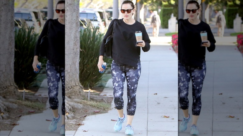 Jennifer Garner wearing galaxy leggings for a walk.