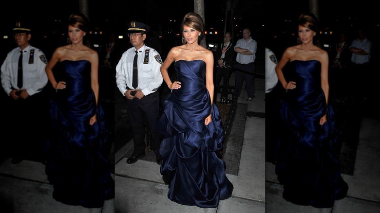 Melania Trump in a satin ballgown with an updo.