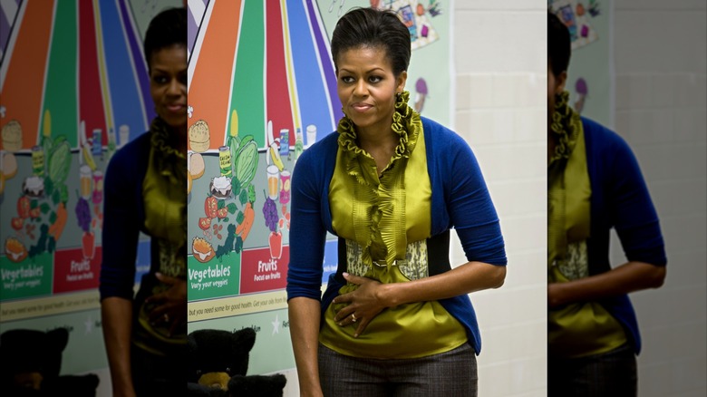 Michelle Obama wearing belted cardigan and blouse