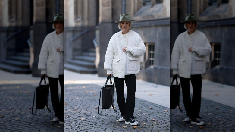 woman wearing white quilted jacket