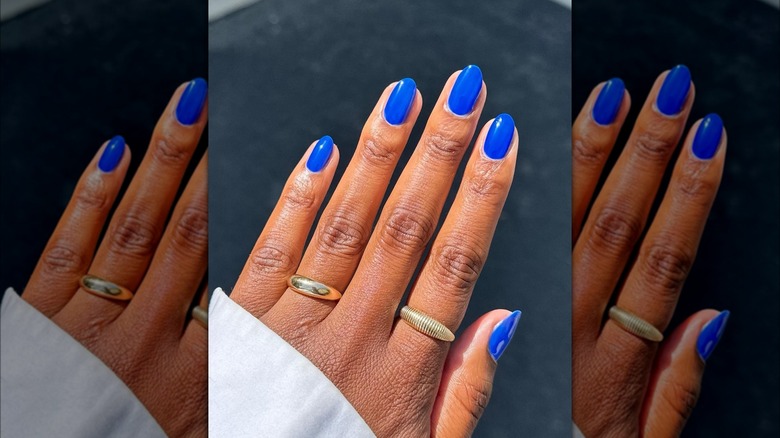 Person with plain blue nails