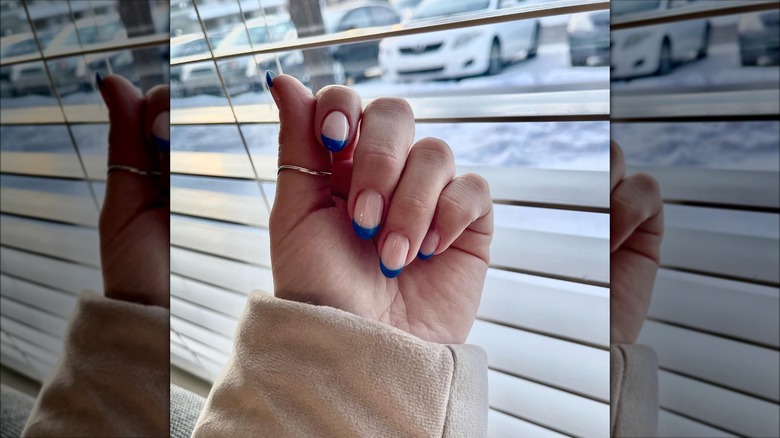 Person with blue french tips