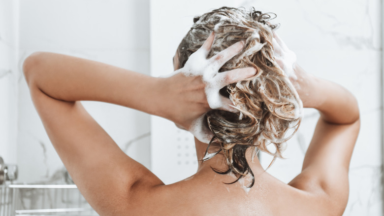 Woman shampooing her hair