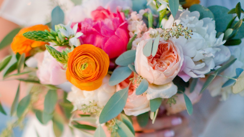 bride holding colorful bouquet