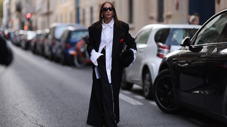 Woman wearing oversized black, white outfit