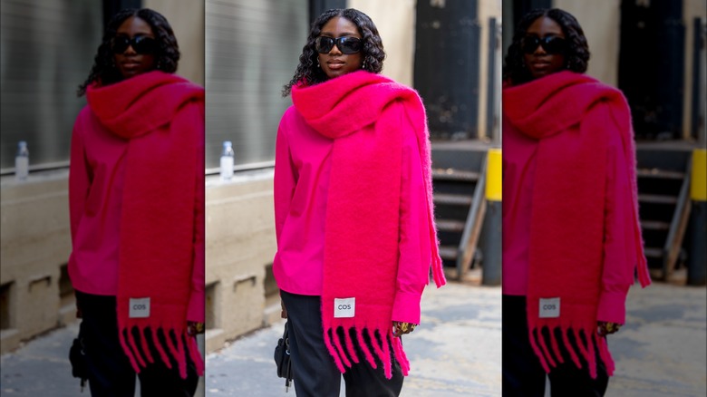 Woman wearing oversized red scarf