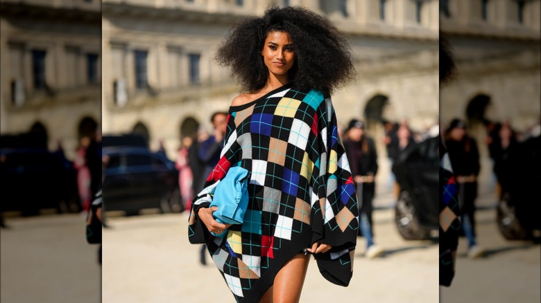 Woman wearing oversized plaid sweater