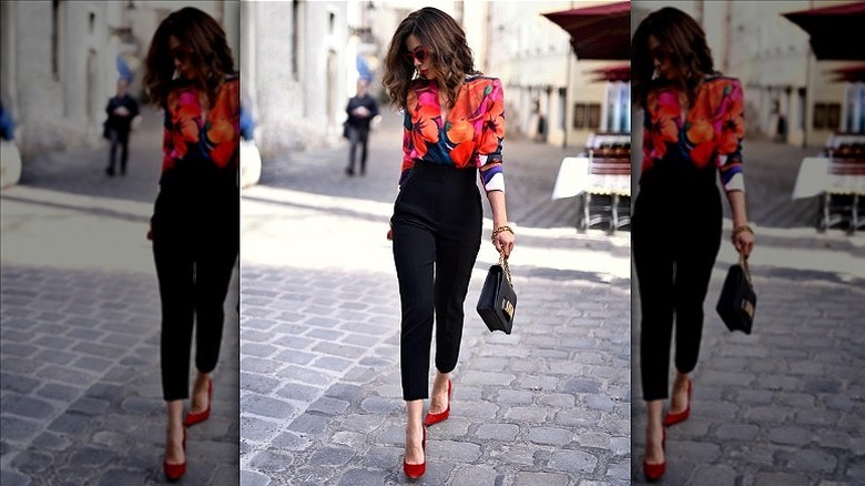 woman with floral blouse and pants