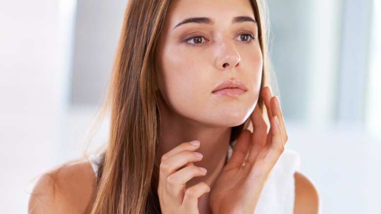 Woman checking out her skin