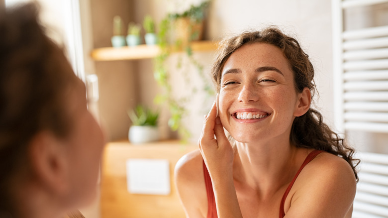 woman applying skincare