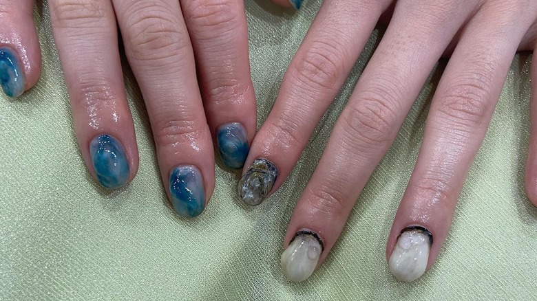 woman with colored oyster nails