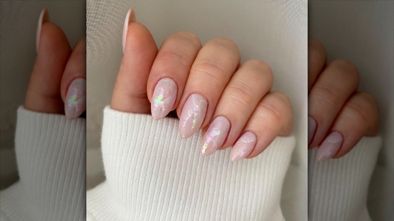 woman with shiny foil manicure