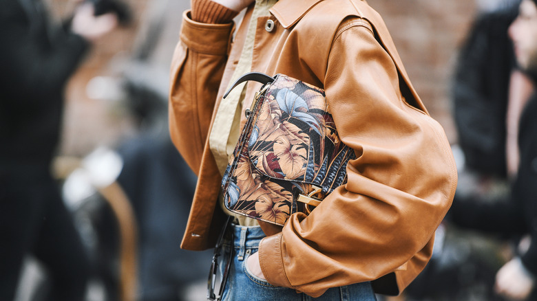 Woman carrying a statement purse