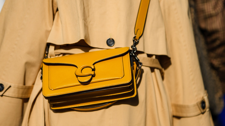 Woman wearing a sunny yellow bag