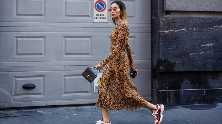 Woman wearing red sneakers