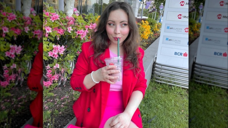 Woman wearing pink and red 