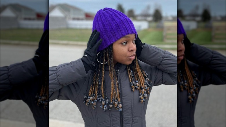 woman wearing purple beanie