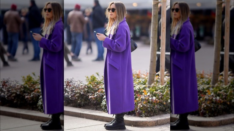 woman wearing purple coat