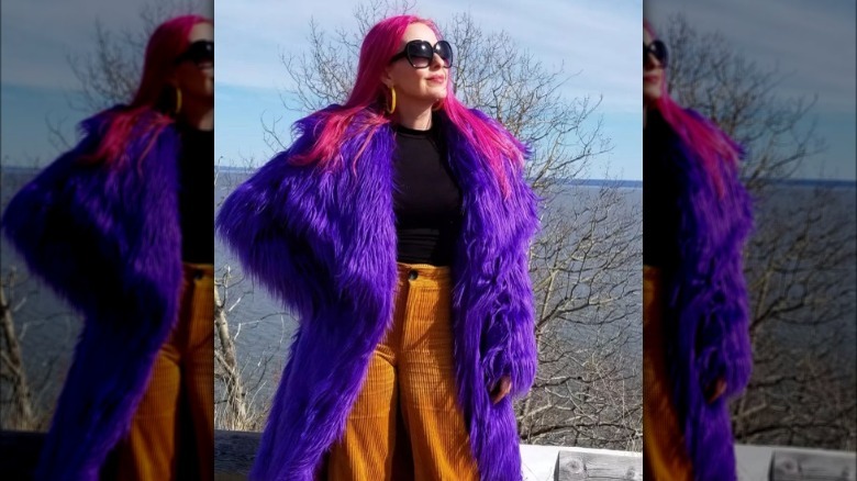 woman wearing purple faux fur coat