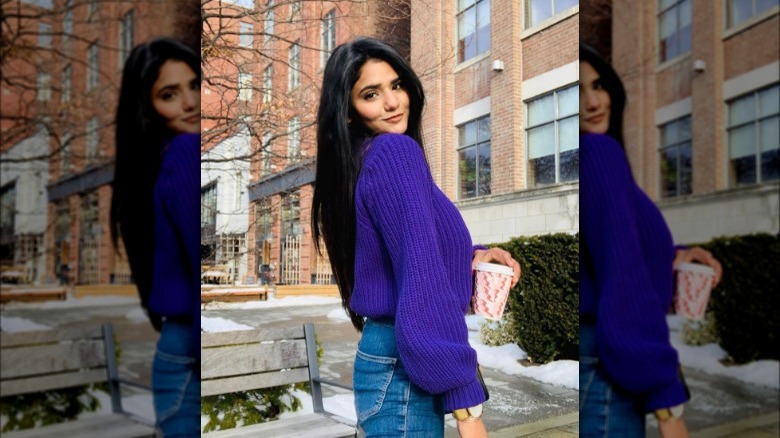 woman wearing purple sweater