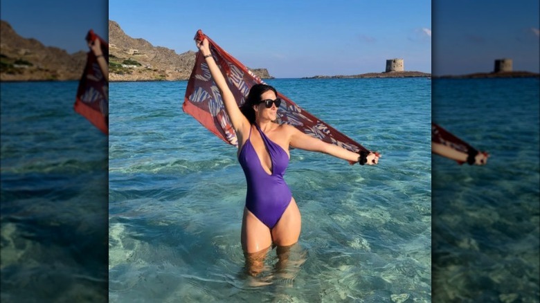 woman wearing purple swimsuit