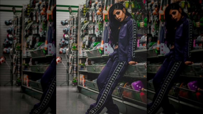 woman wearing purple tracksuit