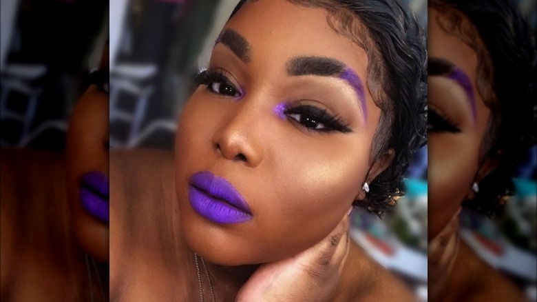 woman wearing purple lipstick