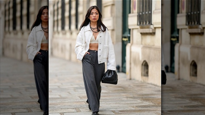 woman wearing bra and grey pants