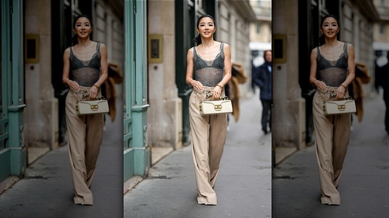 woman wearing bra and beige pants