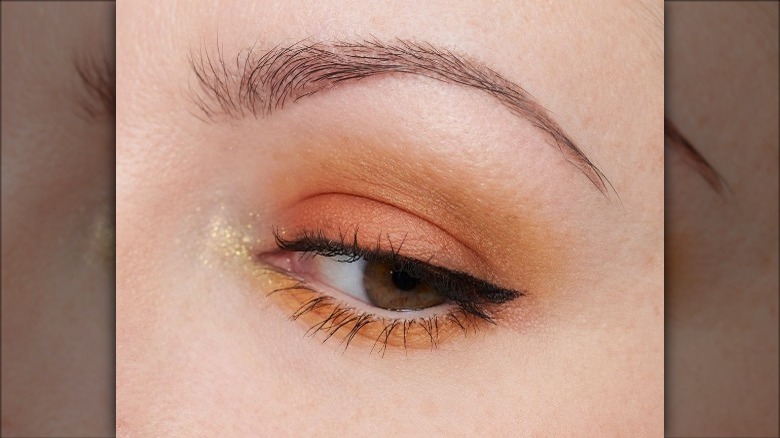 eye with sheer amber eyeshadow