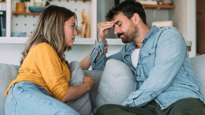 woman talking to stressed man